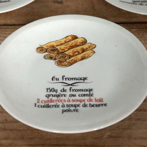 Set of Eight 20th Century Novelty Crepe Recipe Plates